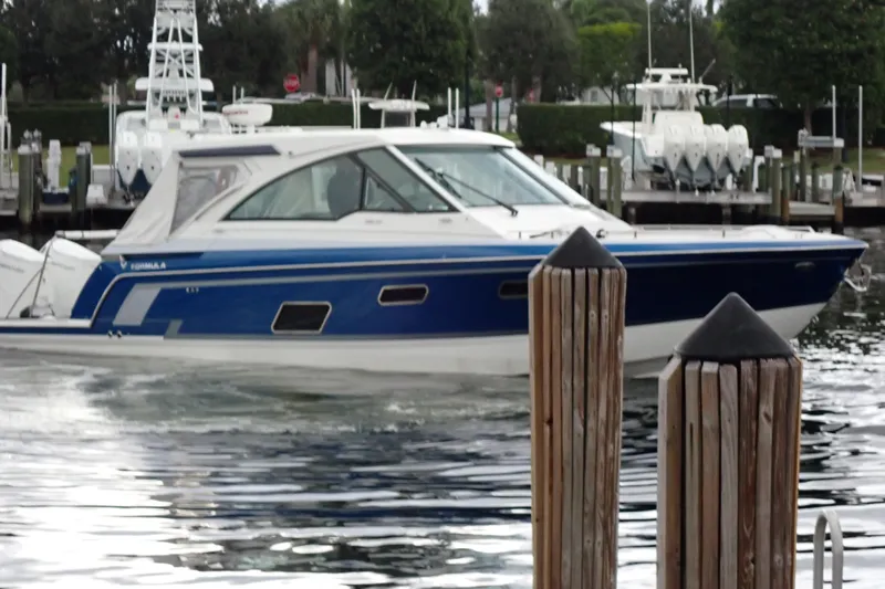  Yacht Photos Pics 2023 Formula 380 Super Sport Crossover OB boat docked in a marina.
