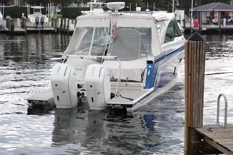  Yacht Photos Pics 2023 Formula 380 Super Sport Crossover OB docked with twin outboard engines.