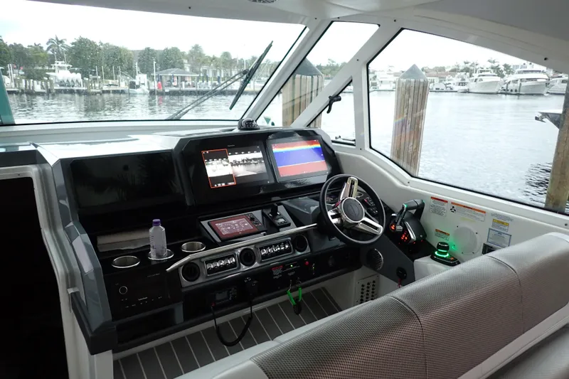  Yacht Photos Pics 2023 Formula 380 Super Sport Crossover OB helm with advanced navigation displays and controls.