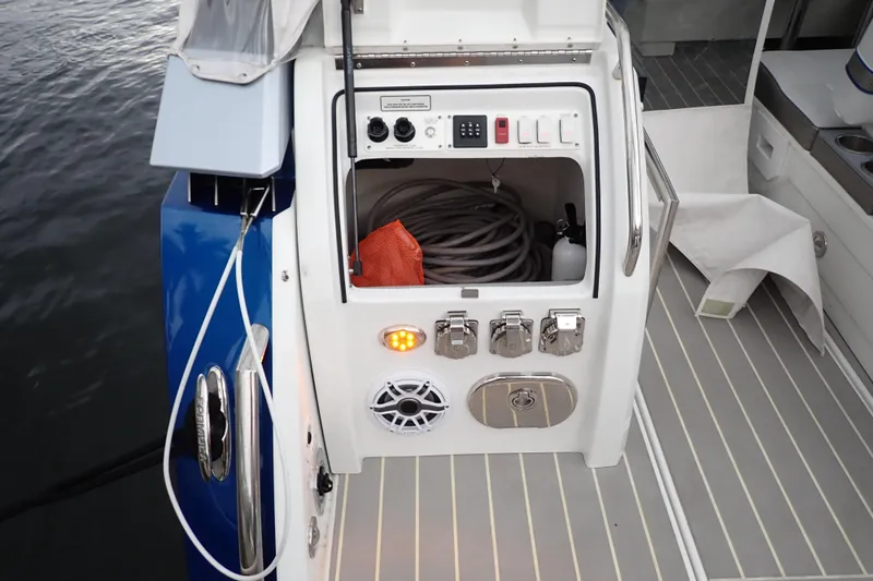  Yacht Photos Pics 2023 Formula 380 Super Sport Crossover OB boat deck with storage compartment open.