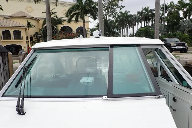  Yacht Photos Pics 2023 Formula 380 Super Sport Crossover OB boat docked near palm trees.