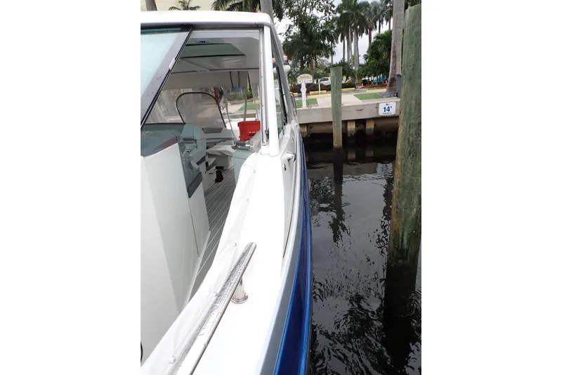  Yacht Photos Pics 2023 Formula 380 Super Sport Crossover OB docked near palm trees.