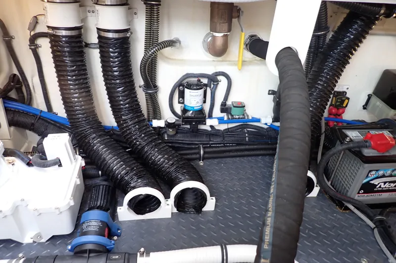  Yacht Photos Pics Engine room of 2023 Formula 380 Super Sport Crossover OB with hoses and equipment.