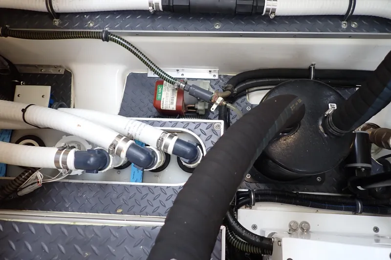  Yacht Photos Pics Engine compartment of 2023 Formula 380 Super Sport Crossover OB with hoses and components.