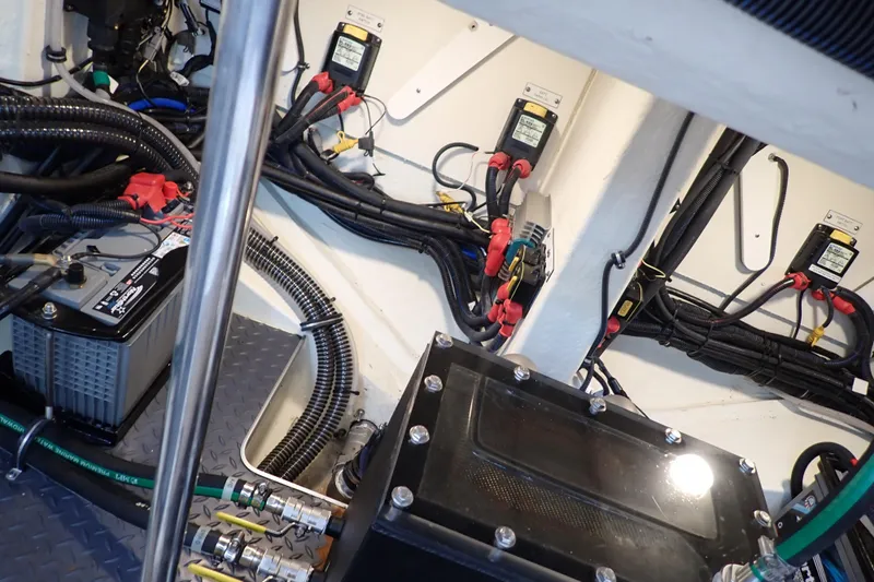  Yacht Photos Pics Engine compartment of 2023 Formula 380 Super Sport Crossover OB, showcasing wiring and battery setup.