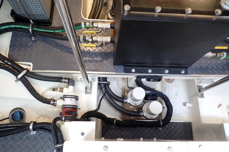  Yacht Photos Pics Engine compartment of 2023 Formula 380 Super Sport Crossover OB with visible hoses and components.