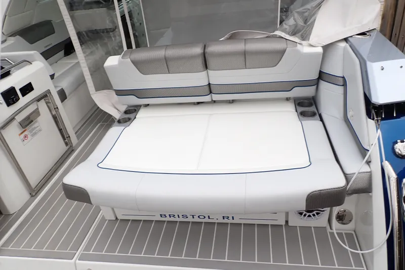  Yacht Photos Pics 2023 Formula 380 Super Sport Crossover OB boat seating area, featuring modern design and cup holders.