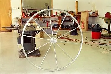 Christine Yacht Photos Pics Large metal wheel in workshop for 1996 Custom 100' Sailing Yacht.