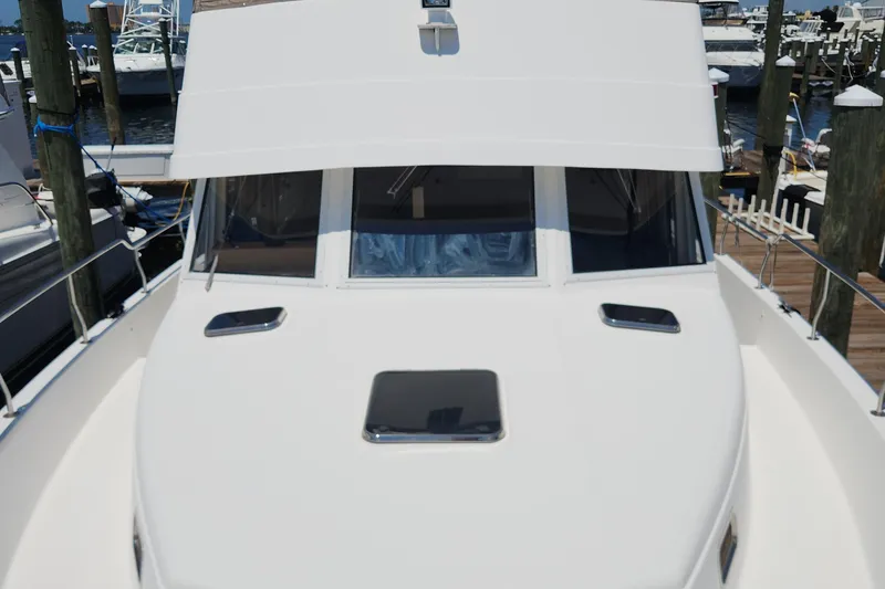  Yacht Photos Pics 2003 Mainship 43 Trawler Aft Cabin at marina, front deck view.