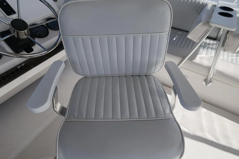  Yacht Photos Pics Captain's chair on 2003 Mainship 43 Trawler Aft Cabin, near steering wheel.