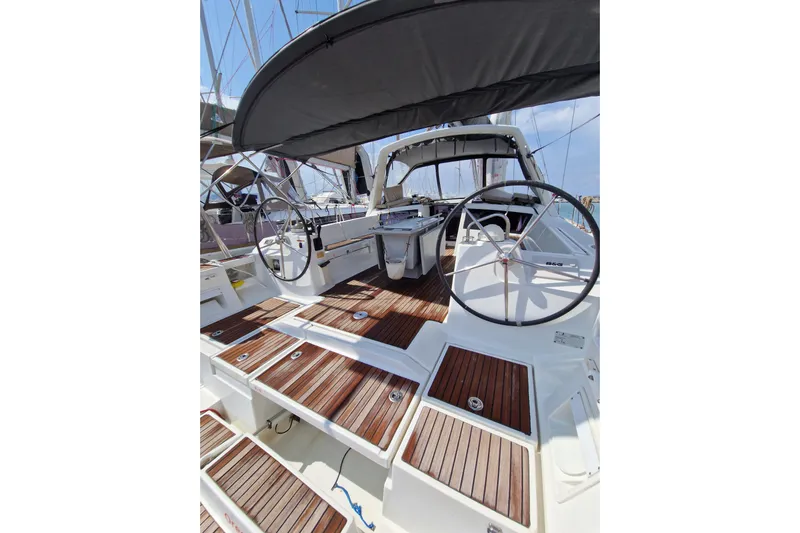  Yacht Photos Pics 2014 Beneteau Oceanis 48 sailboat cockpit with dual steering wheels and teak decking.