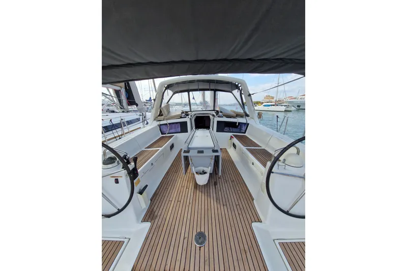  Yacht Photos Pics 2014 Beneteau Oceanis 48 yacht cockpit with dual steering wheels and teak flooring.