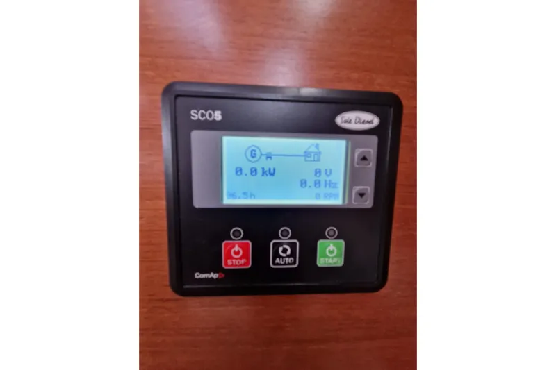  Yacht Photos Pics Control panel on 2014 Beneteau Oceanis 48 sailboat, displaying power and frequency settings.