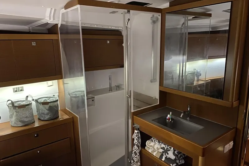  Yacht Photos Pics Luxurious bathroom interior of 2014 Beneteau Oceanis 48 yacht with modern fixtures.