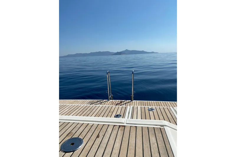  Yacht Photos Pics Beneteau Oceanis 48 yacht deck with serene ocean view, 2014 model.