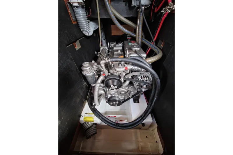  Yacht Photos Pics Engine compartment of a 2014 Beneteau Oceanis 48 sailboat, showcasing mechanical components.