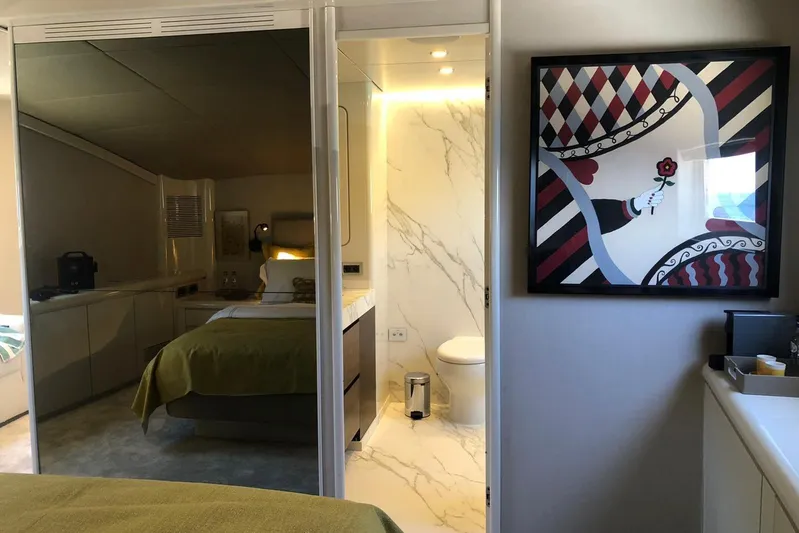 Axella Yacht Photos Pics Luxurious Crestitalia 33m yacht interior, featuring a modern bedroom and elegant bathroom, 1991 model.