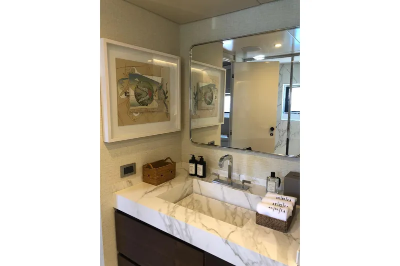 Axella Yacht Photos Pics Luxurious yacht bathroom with marble sink, modern fixtures, and elegant artwork, Crestitalia 33m, 1991.