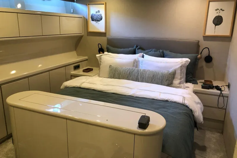 Axella Yacht Photos Pics Luxurious bedroom interior on a 1991 Crestitalia 33m yacht, featuring elegant decor and modern amenities.