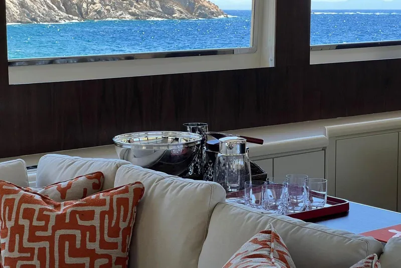 Axella Yacht Photos Pics Luxurious yacht interior with ocean view, featuring elegant decor and glassware on a Crestitalia 33m, 1991.