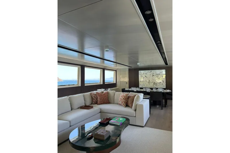 Axella Yacht Photos Pics Luxurious interior of 1991 Crestitalia 33m yacht with elegant seating and ocean view.