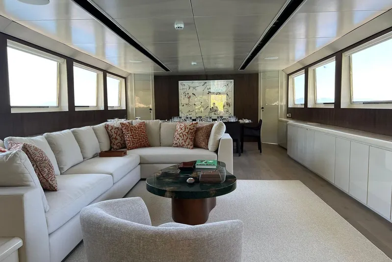 Axella Yacht Photos Pics Luxurious interior of 1991 Crestitalia 33m yacht with elegant seating and modern decor.