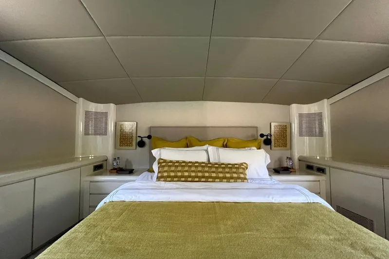 Axella Yacht Photos Pics Luxurious bedroom interior of 1991 Crestitalia 33m yacht with elegant bedding and decor.