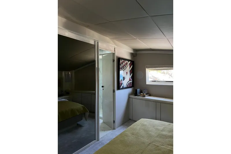 Axella Yacht Photos Pics Interior of 1991 Crestitalia 33m yacht with modern decor and artwork.