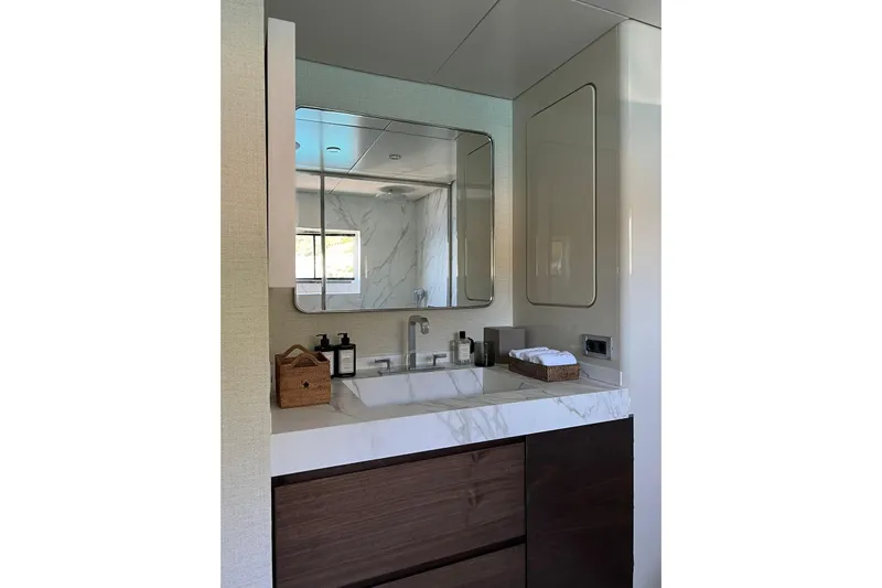 Axella Yacht Photos Pics Luxurious bathroom in 1991 Crestitalia 33m yacht with marble sink and modern fixtures.