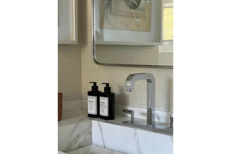 Axella Yacht Photos Pics Modern bathroom sink with marble countertop, chrome faucet, and luxury soap dispensers.