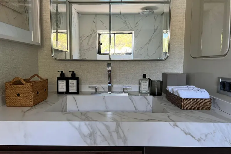 Axella Yacht Photos Pics Luxurious marble bathroom sink with elegant accessories on a Crestitalia 33m yacht, 1991 model.