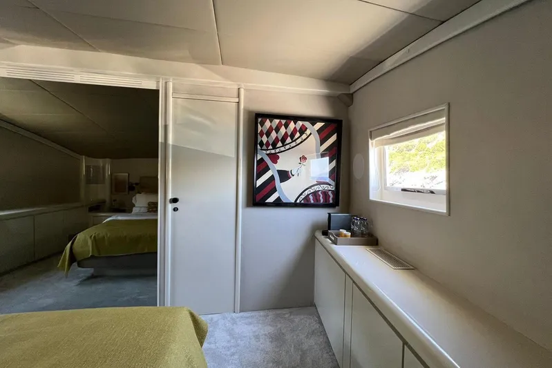 Axella Yacht Photos Pics Interior of 1991 Crestitalia 33m yacht with modern art and window view.