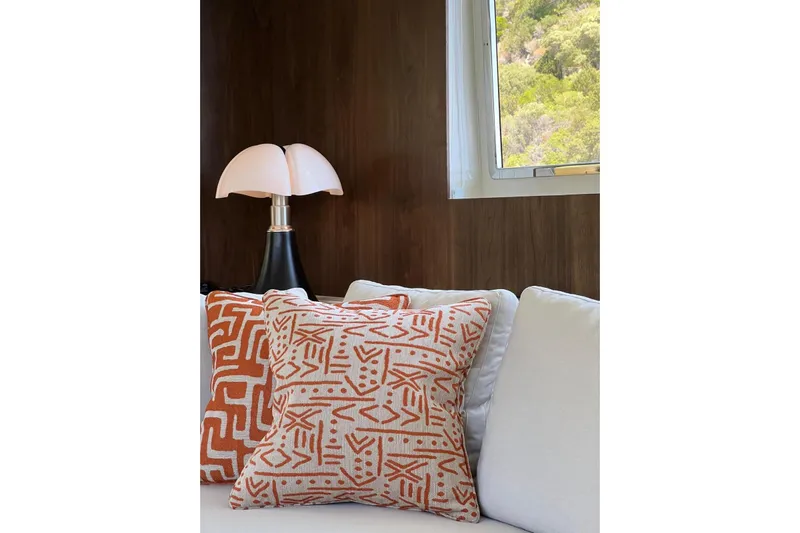 Axella Yacht Photos Pics Crestitalia 33m yacht interior with patterned cushions and modern lamp, 1991 model.