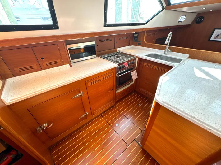 Tack Yacht Photos Pics Interior view of a 1999 Bowman 48 Aft Cockpit yacht kitchen.