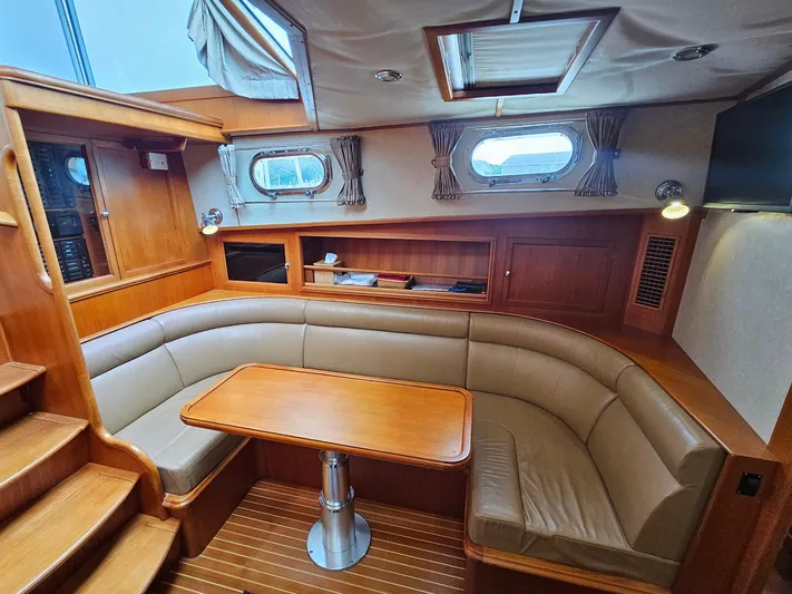 Journey Yacht Photos Pics Luxurious 2007 Grand Banks 39 Eastbay SX yacht interior with elegant seating and wooden finishes.