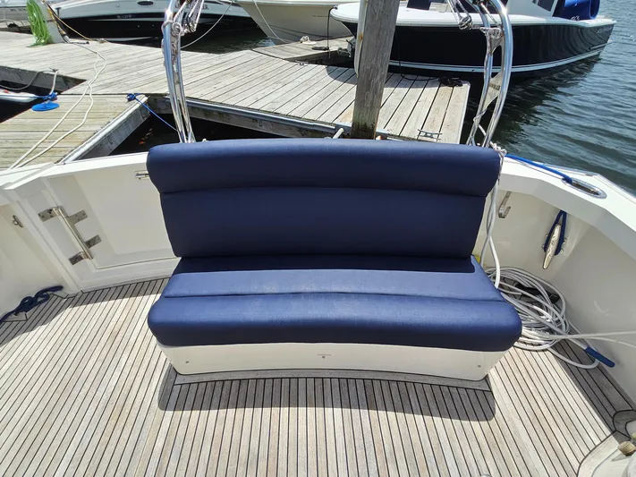 Journey Yacht Photos Pics Blue cushioned bench on 2007 Grand Banks 39 Eastbay SX yacht deck.