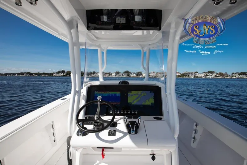  Yacht Photos Pics 2024 Jupiter 34 boat console with navigation system on open water.
