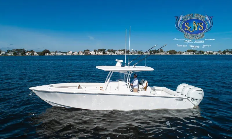  Yacht Photos Pics 2024 Jupiter 34 boat cruising on a lake, South Jersey Yacht Sales logo.