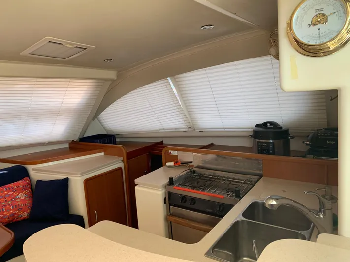  Yacht Photos Pics Interior of 2010 Leopard 40 yacht kitchen with stove, sink, and appliances.