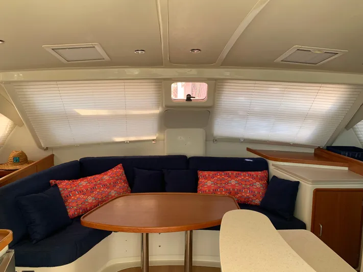  Yacht Photos Pics Interior of 2010 Leopard 40 catamaran with cozy seating and colorful cushions.