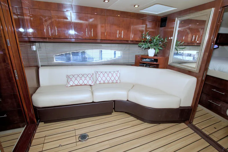 Serenity In The Sea Yacht Photos Pics Luxurious interior of 2014 Regal 46 Sport Coupe with elegant seating and wood finishes.