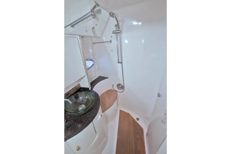 Serenity In The Sea Yacht Photos Pics Luxurious bathroom in 2014 Regal 46 Sport Coupe yacht with modern fixtures.