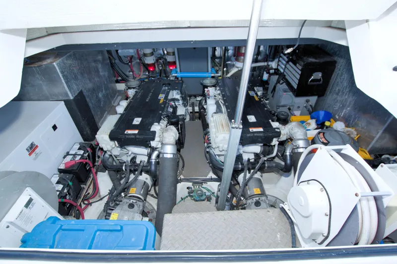 Serenity In The Sea Yacht Photos Pics Engine room of 2014 Regal 46 Sport Coupe with dual engines and equipment.
