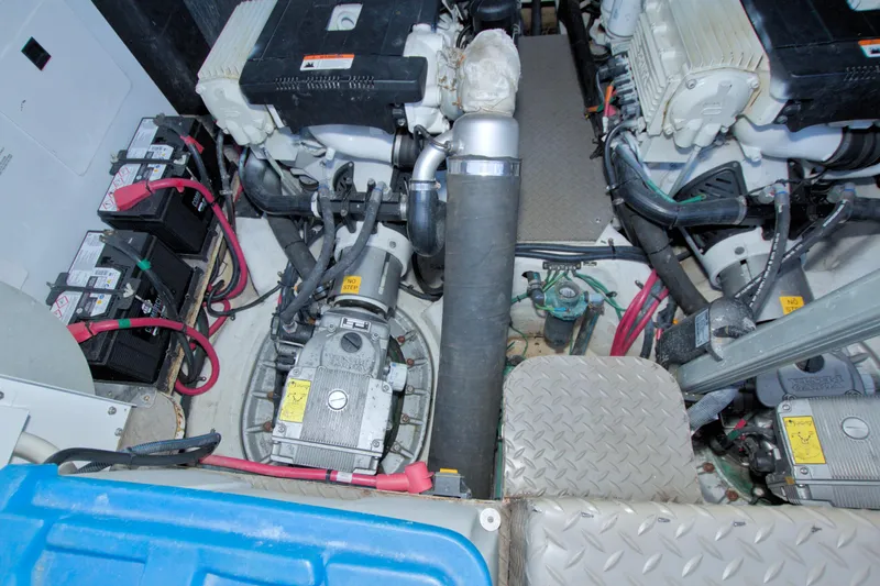 Serenity In The Sea Yacht Photos Pics Engine room of a 2014 Regal 46 Sport Coupe with visible batteries and machinery.