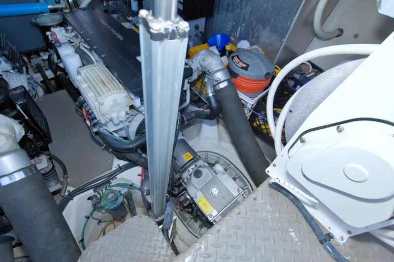 Serenity In The Sea Yacht Photos Pics Engine room of 2014 Regal 46 Sport Coupe with visible components and wiring.