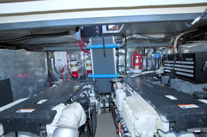 Serenity In The Sea Yacht Photos Pics Engine room of 2014 Regal 46 Sport Coupe with visible machinery and equipment.