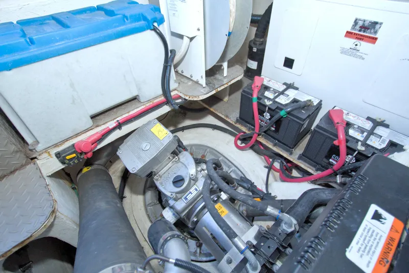 Serenity In The Sea Yacht Photos Pics Engine compartment of 2014 Regal 46 Sport Coupe with batteries and mechanical components.