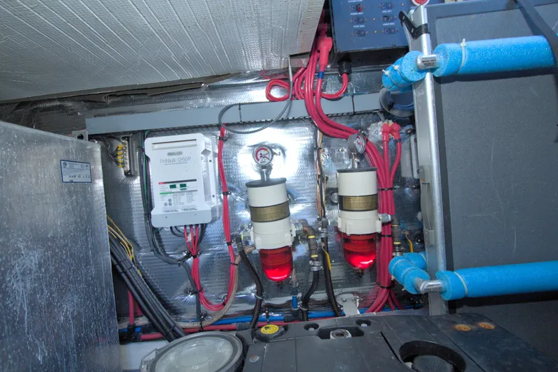 Serenity In The Sea Yacht Photos Pics Engine room of 2014 Regal 46 Sport Coupe with wiring and filtration systems.