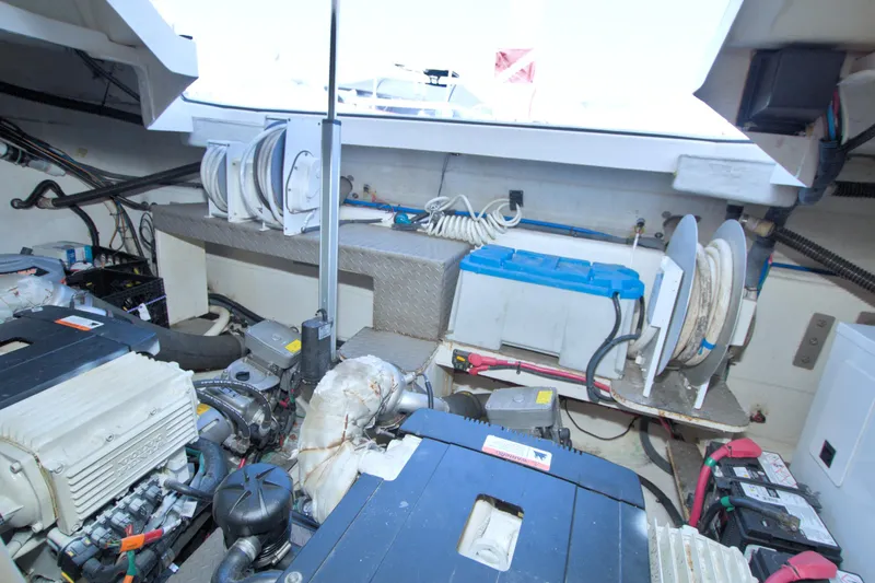 Serenity In The Sea Yacht Photos Pics Engine room of 2014 Regal 46 Sport Coupe with visible equipment and wiring.