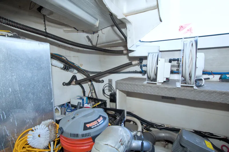 Serenity In The Sea Yacht Photos Pics Engine room of 2014 Regal 46 Sport Coupe with hoses and equipment.